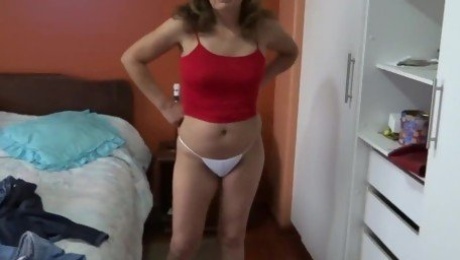 58-year-old Latina MILF shows off in erotic lingerie before fucking